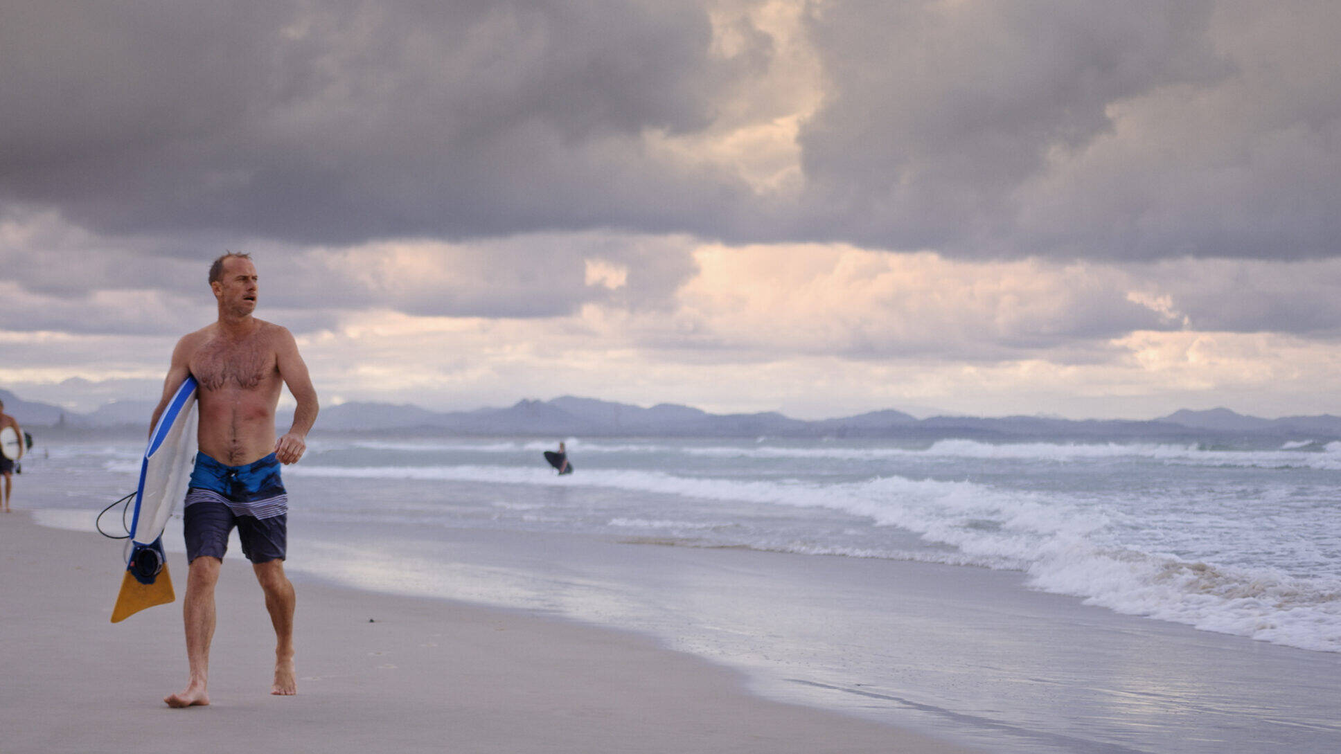 A surfer on Belongil Beach, Australia